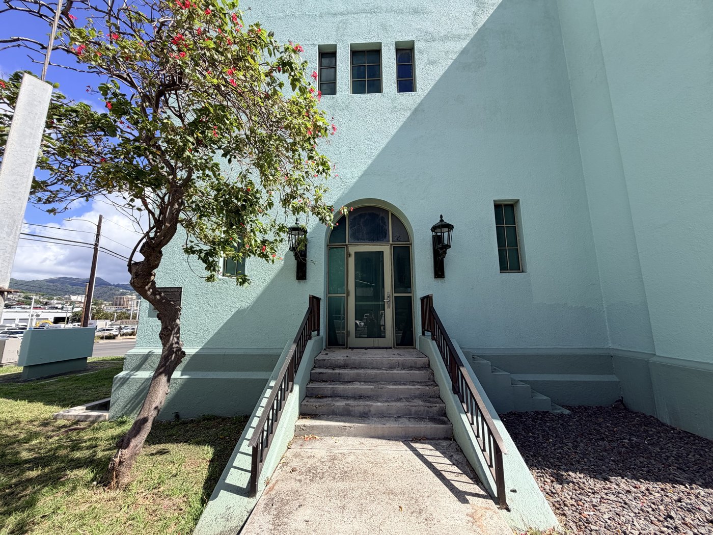 The Kalihi Pumping Station on North King Street, freshly painted, October 2026. The plaque beside the door reads &ldquo;Erected 1927&rdquo; &mdash; this building replaced the one James knew &mdash; but the 1899 steam pump he ran is kept inside. Photograph by Craig Walsh.