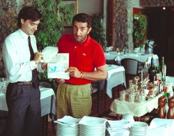 Marjorie and I were on our Mediterranean cruise (holiday!). We were also in the process of starting Transax SpA in Italy (bad move). Duilio and Sergio drove to Portofino to have lunch with us on our port stop. I've enlarged the photo to see what paperwork they're holding --- it's an application for a Corporate American Express Card. A lasting memory of Duilio and Sergio --- in a restaurant, with a food cart and credit card application.