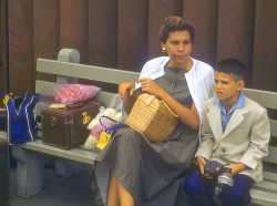 I think this was taken at Honolulu Airport. Note the luggage and my little travelling blazer: in those days we dressed up to take an airplane somewhere. I was already taking photographs: note the camera. I'd obviously done something to make my mother happy, since she has such a Happy Face. Not!