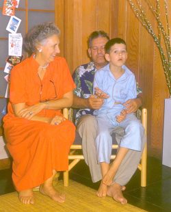 The thing I like best about this photograph, taken circa 1956, are our bare feet. I zoomed in on them with Photoshop, and they're pretty well worn. No wearing of house slippers for us --- bare feet!